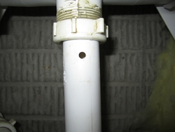 Drill a hole in the pipe